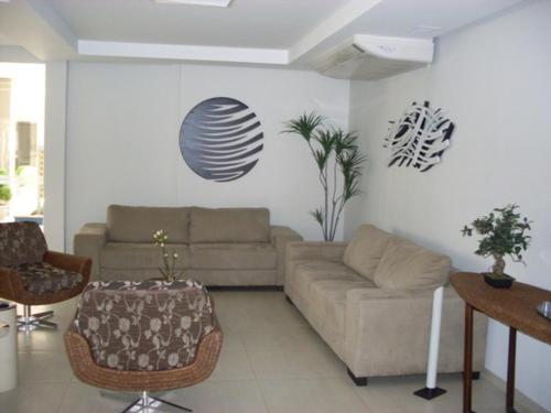 a living room with a couch and a table at Eldorado Park Caldas Novas in Caldas Novas