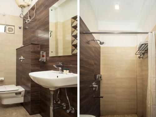 a bathroom with a sink and a toilet at Hotel Mount View, Siliguri in Siliguri