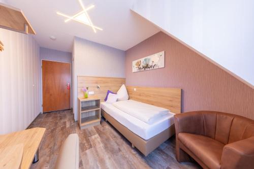 Ένα ή περισσότερα κρεβάτια σε δωμάτιο στο Hotel Reinhardtshof Garni