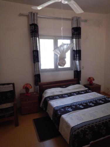 a bedroom with two beds and a window at Residence Saint James in Somone