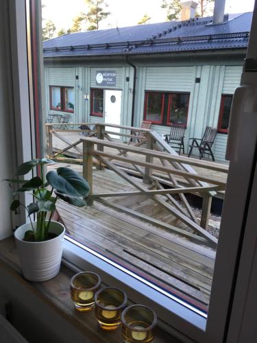 a view of a deck from a window at STF Svartsö Skärgårdshotell & Vandrarhem in Svartsö