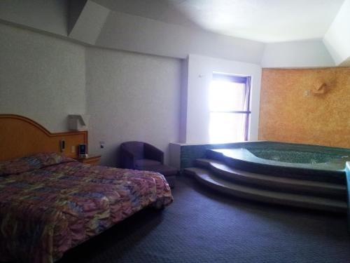 Ένα ή περισσότερα κρεβάτια σε δωμάτιο στο Hotel Inn Sur