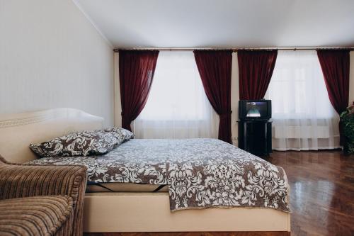 Postel nebo postele na pokoji v ubytování Apartment Centr neer Manufaktura on Kharkovskaya