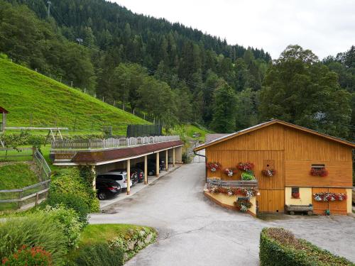 a building with a car parked in front of it at Eisbacherhof in Schladming