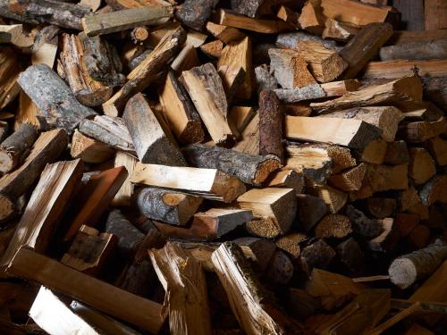 a pile of wood and a pile of beams at Eisbacherhof in Schladming