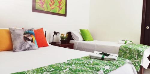 Ένα ή περισσότερα κρεβάτια σε δωμάτιο στο Hotel Tropical