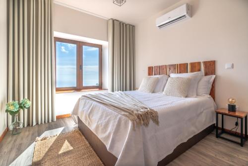 Postel nebo postele na pokoji v ubytování Rochão Village by Rent2U, Lda