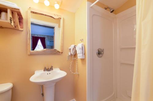 a bathroom with a sink and a shower at Black Elk Resort in Hill City