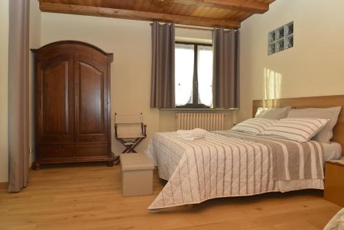 Postel nebo postele na pokoji v ubytování Agriturismo Ai Prüsot