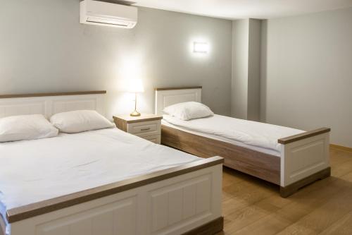 Voodi või voodid majutusasutuse Wellness Apart Hotel toas