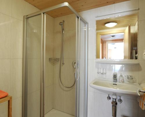 a bathroom with a shower and a sink at Haus Annelies in Au im Bregenzerwald