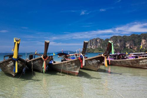 a group of boats sitting in the water at Railay Bay Resort & Spa in Railay Beach