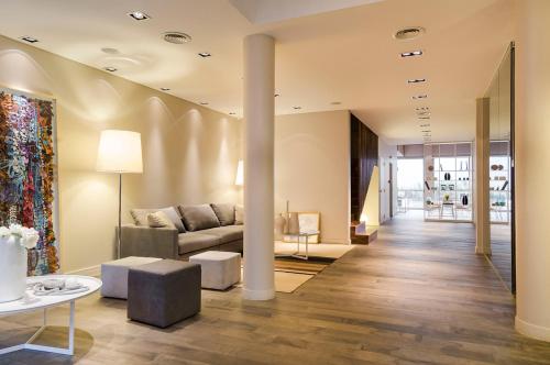a living room with a couch and a table at Lemon Suites in Buenos Aires