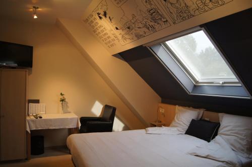 Postel nebo postele na pokoji v ubytování B&B Het Wouwe