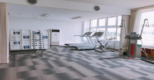 a large room with a gym with tread machines at KIBOTCHA / Vacation STAY 8351 in Higashimatsushima