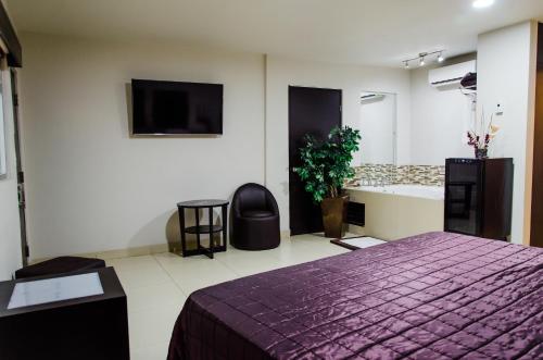 Ein Bett oder Betten in einem Zimmer der Unterkunft Hotel Velario