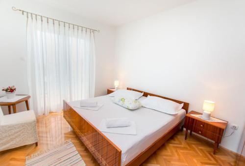 Posteľ alebo postele v izbe v ubytovaní Apartment Stane