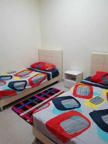 Postel nebo postele na pokoji v ubytování V’Auliya Residence