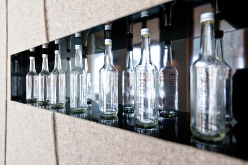 a bunch of glass bottles on a shelf at Ferienpension Senfter in Innervillgraten