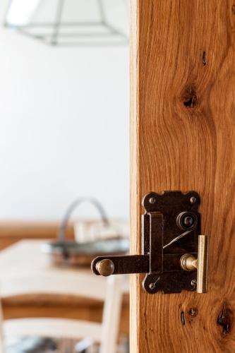 a wooden door with a lock on it at B&B Arcadia in Gualtieri
