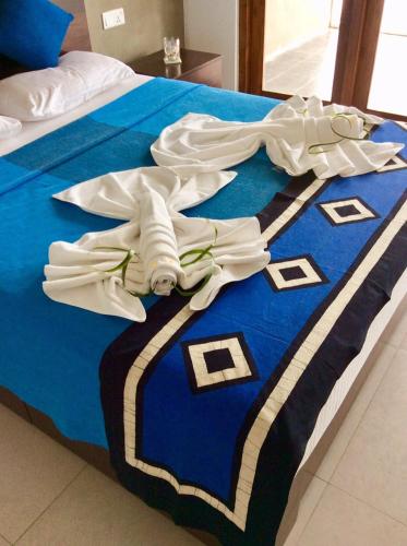 Ένα ή περισσότερα κρεβάτια σε δωμάτιο στο White Sand Villa - Beach front