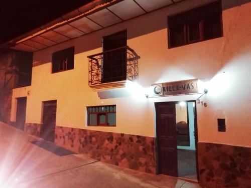 a building with a door and a balcony at Killa Wasi Chachapoyas in Chachapoyas