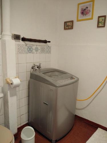a small bathroom with a toilet and a sink at Doña Irene B & B in Rancagua