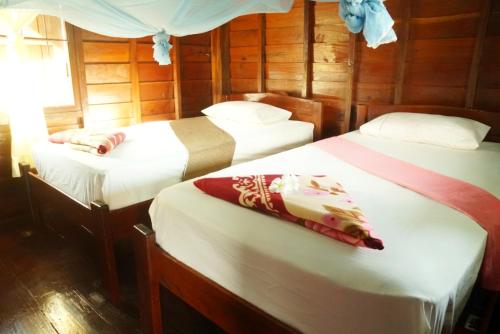 Postel nebo postele na pokoji v ubytování The Boathouse