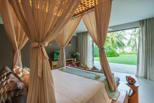 Giường trong phòng chung tại Mia Resort Nha Trang