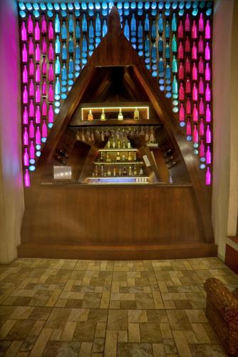 a view of a wine tasting room with colorful lights at Goldfinch Hotel Bangalore in Bengaluru