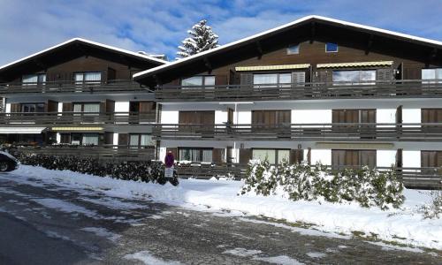 a large building with snow in front of it at Apartmenthaus Panorama in Seefeld in Tirol