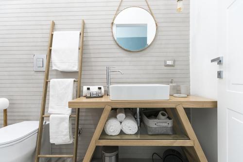 a bathroom with a sink and a mirror at Bellini Suite in Naples