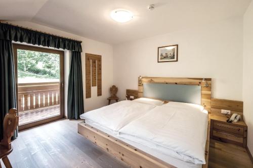 Postel nebo postele na pokoji v ubytování Hotel Feldrand