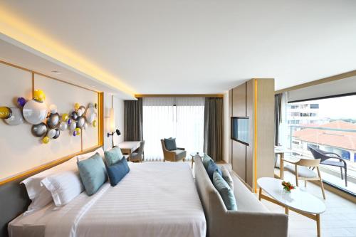 Katil atau katil-katil dalam bilik di M Pattaya Hotel - SHA Extra Plus