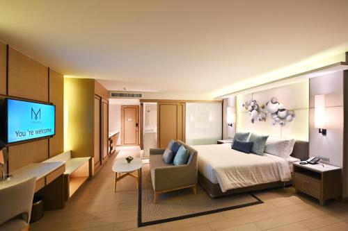 Katil atau katil-katil dalam bilik di M Pattaya Hotel - SHA Extra Plus