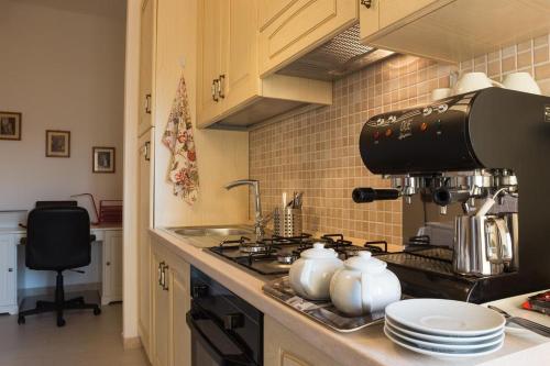 Kuchyň nebo kuchyňský kout v ubytování Home Sweet Home B&B