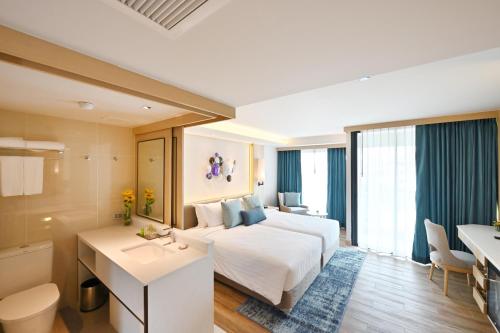 Katil atau katil-katil dalam bilik di M Pattaya Hotel - SHA Extra Plus