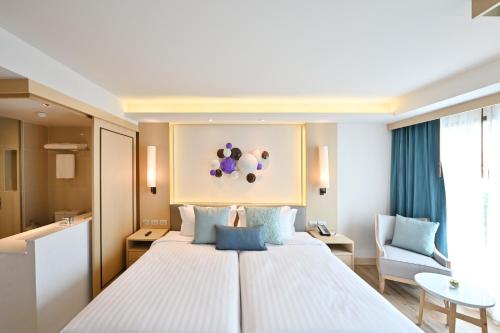 Katil atau katil-katil dalam bilik di M Pattaya Hotel - SHA Extra Plus