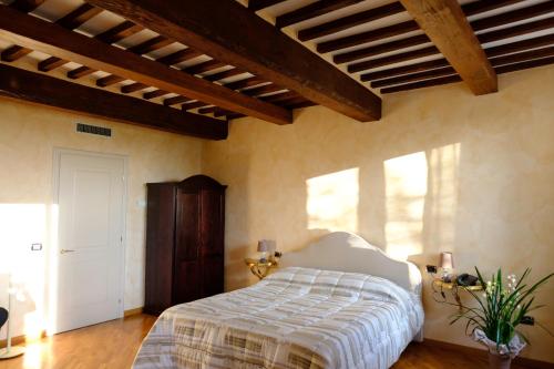 Ένα ή περισσότερα κρεβάτια σε δωμάτιο στο Agriturismo Corte Palazzo