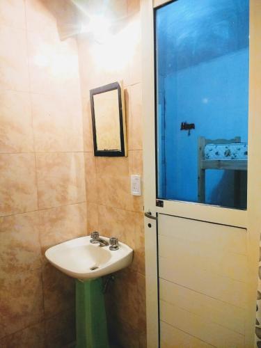 a bathroom with a white sink and a mirror at Mate de luna in Buenos Aires