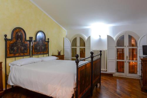 Katil atau katil-katil dalam bilik di Locanda Al Portone
