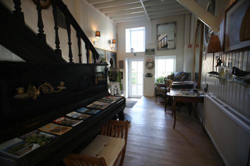 a hallway of a house with a staircase and a table at Barsy 34 in Havelange