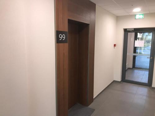 an office elevator with a door with the number on it at Kauno-Algirdo Luxury apartments in Vilnius
