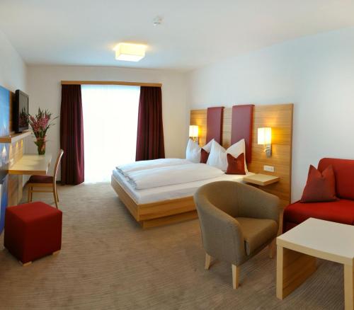 Postel nebo postele na pokoji v ubytování Hotel Sonnschupfer