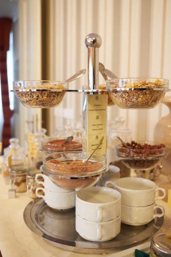a table with two bowls of food on a stand at Apartment Travego II in Osijek