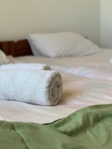 a stuffed animal laying on top of a bed at Apartments Radingturs in Žabljak