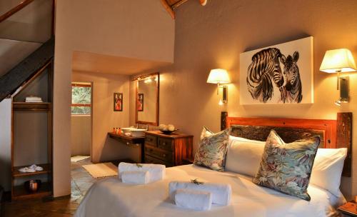 Katil atau katil-katil dalam bilik di Garden Route Safari Camp