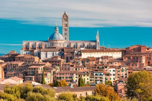 a view of a city with a tall building at Villa Fiorenzani in Radicondoli