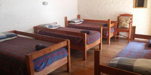 Una cama o camas en una habitación de Old Transvaal Inn Accommodation
