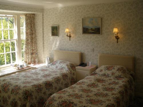 Ένα ή περισσότερα κρεβάτια σε δωμάτιο στο Lastingham Grange